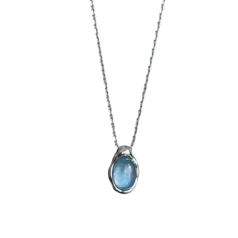 Navy blue water drop pendant necklace with cross chain in electroplated platinum colour finish