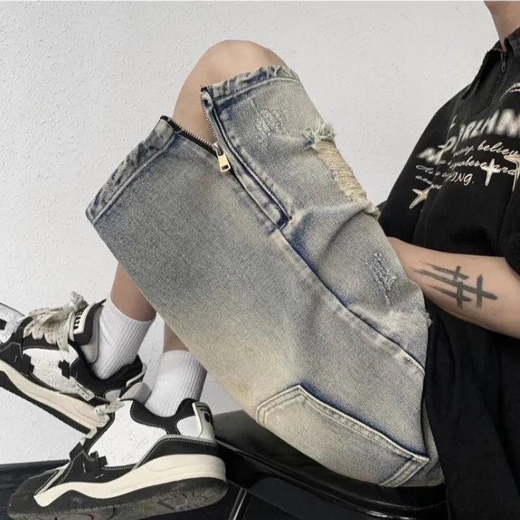 Blue retro-style tattered denim shorts with a wide leg loose fit on a hanger.