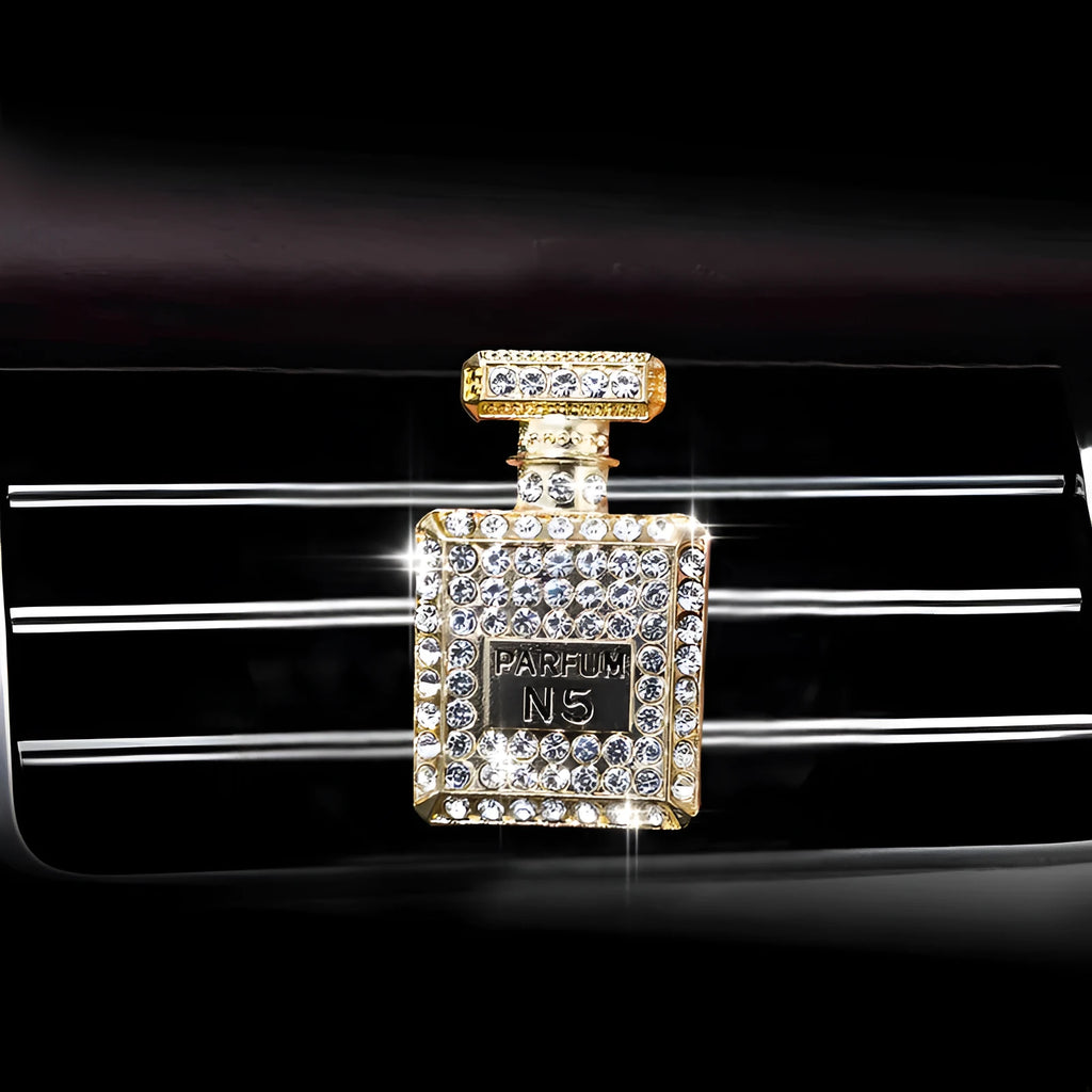 Gold alloy car air freshener holder in perfume bottle style, approx. 4.7cm x 3cm, for fragrance tablets