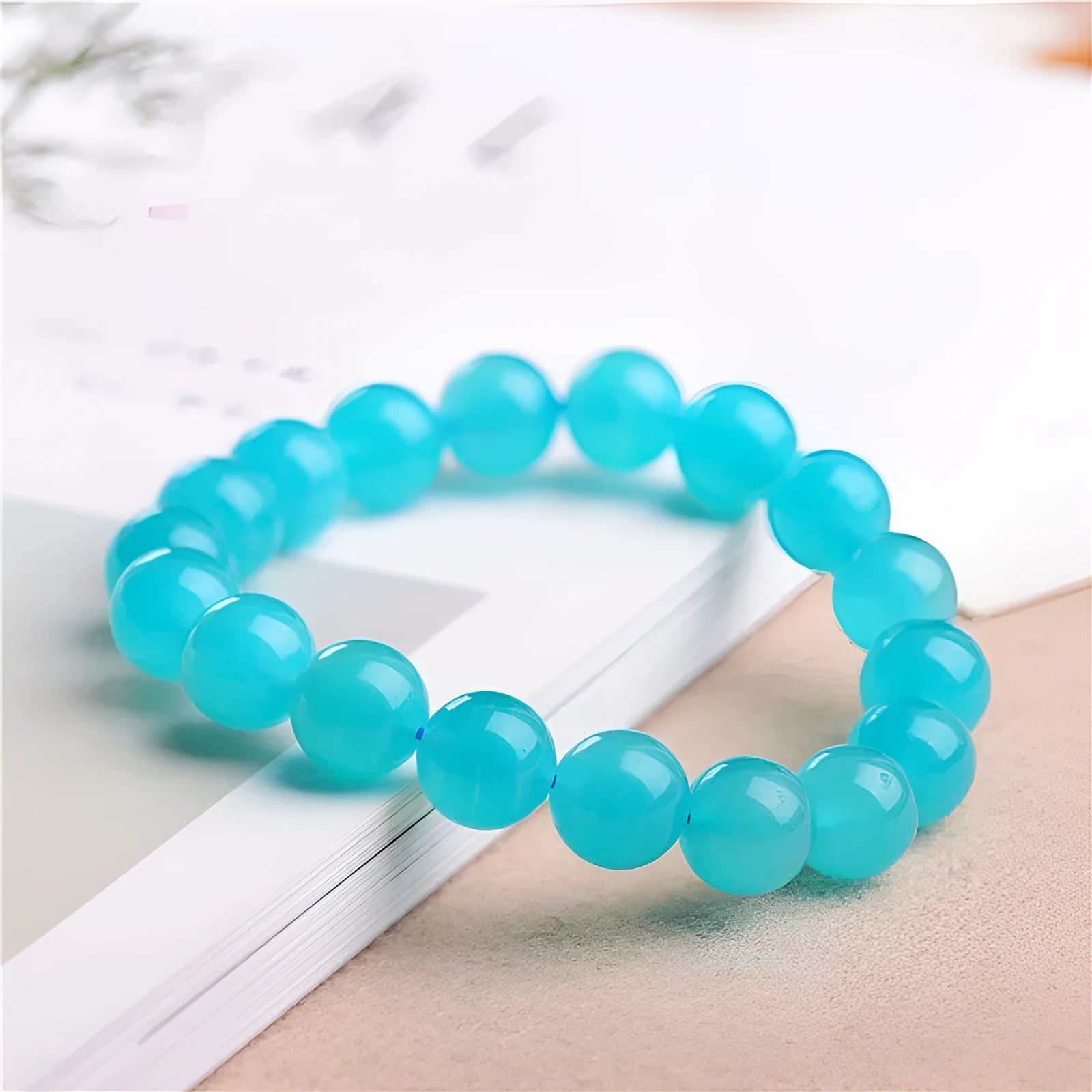 Natural amazonite scattered beads in blue-green ice colour showing polished surfaces and multiple size options