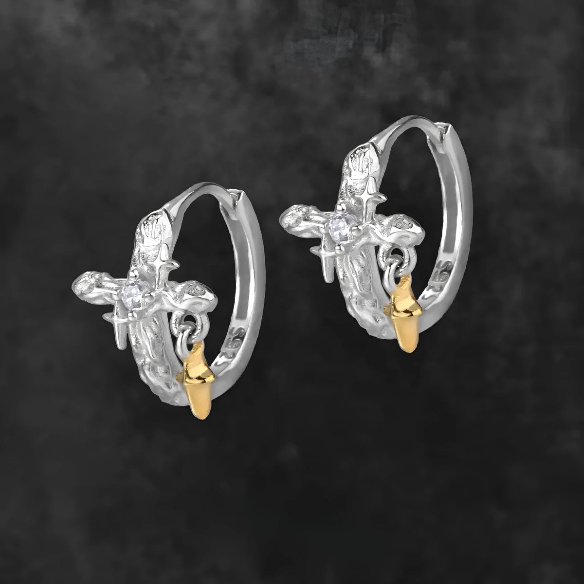 Pair of 925 sterling silver geometric cross earrings with a white gold colour electroplated finish.