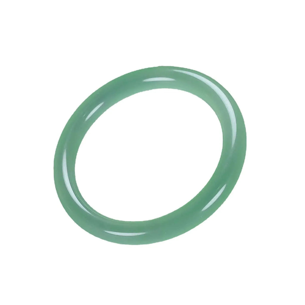 Jade bracelet with floating flower design in ice-like emerald tones and auspicious patterns