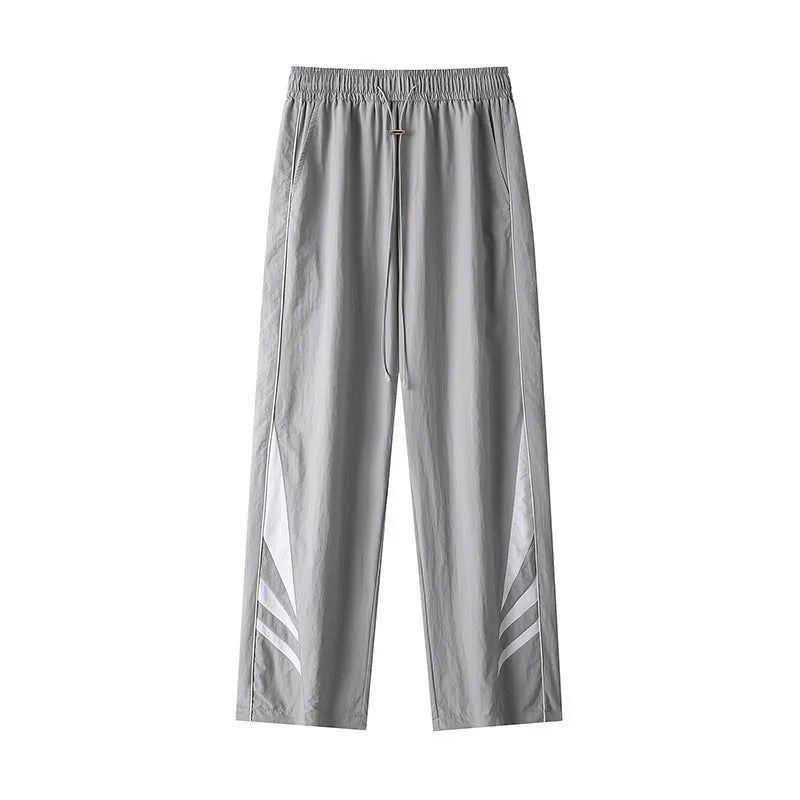 Men's straight leg casual trousers in grey, featuring an elasticated waistband and a loose fit.