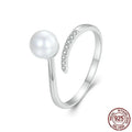 Sterling silver adjustable pearl ring with open loop design showing natural shell pearls on S925 silver band