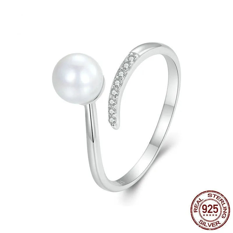 Sterling silver adjustable pearl ring with open loop design showing natural shell pearls on S925 silver band