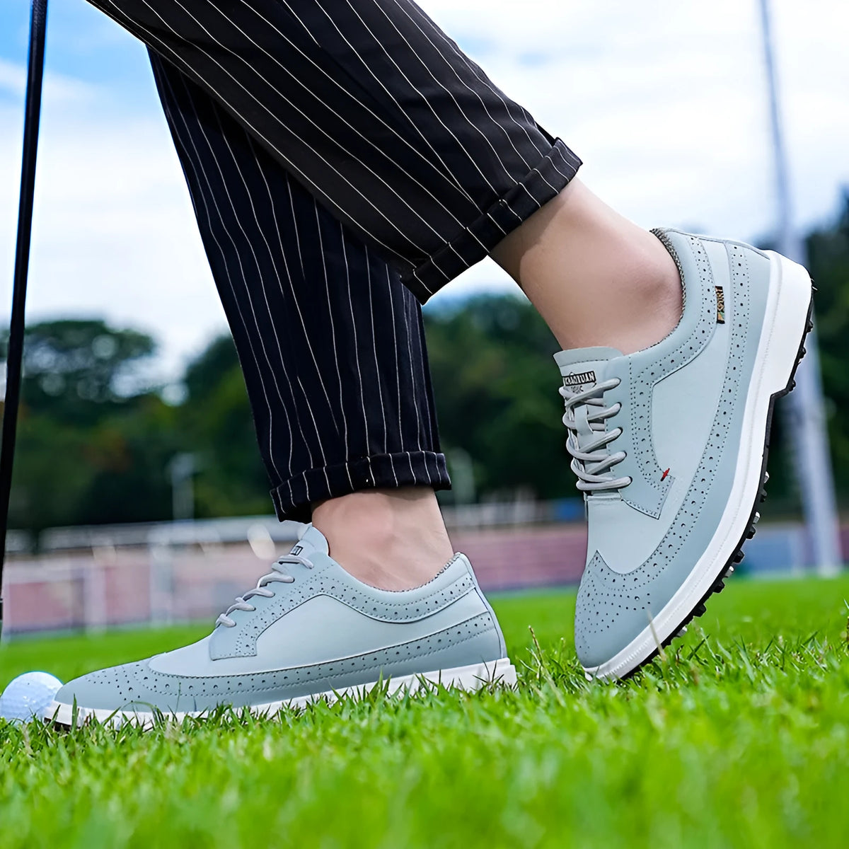 Men's lightweight golf shoe in Lake Blue or White with genuine leather upper and non-slip rubber outsole, sizes 39-47
