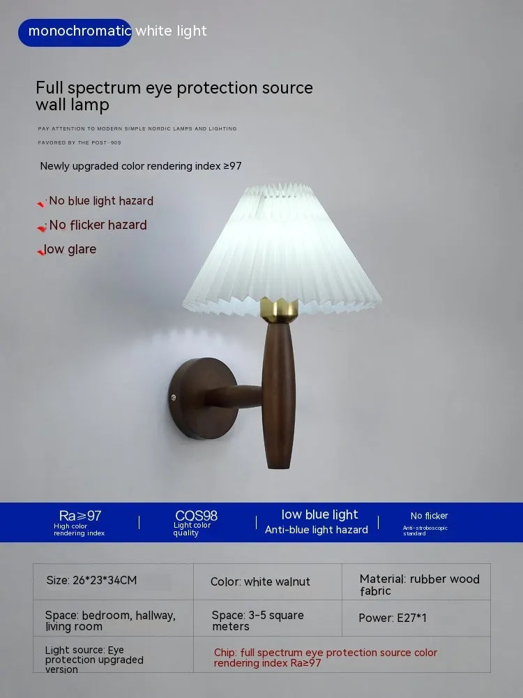 American retro-style wooden wall lamp with a fabric shade in a walnut finish on a bedroom wall.