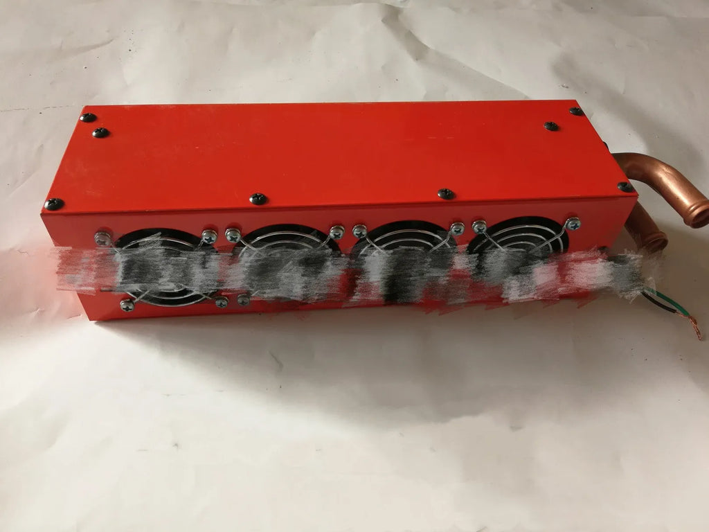 Metal car heater unit with long small four-hole copper pipe connections for 12V 24V vehicles.