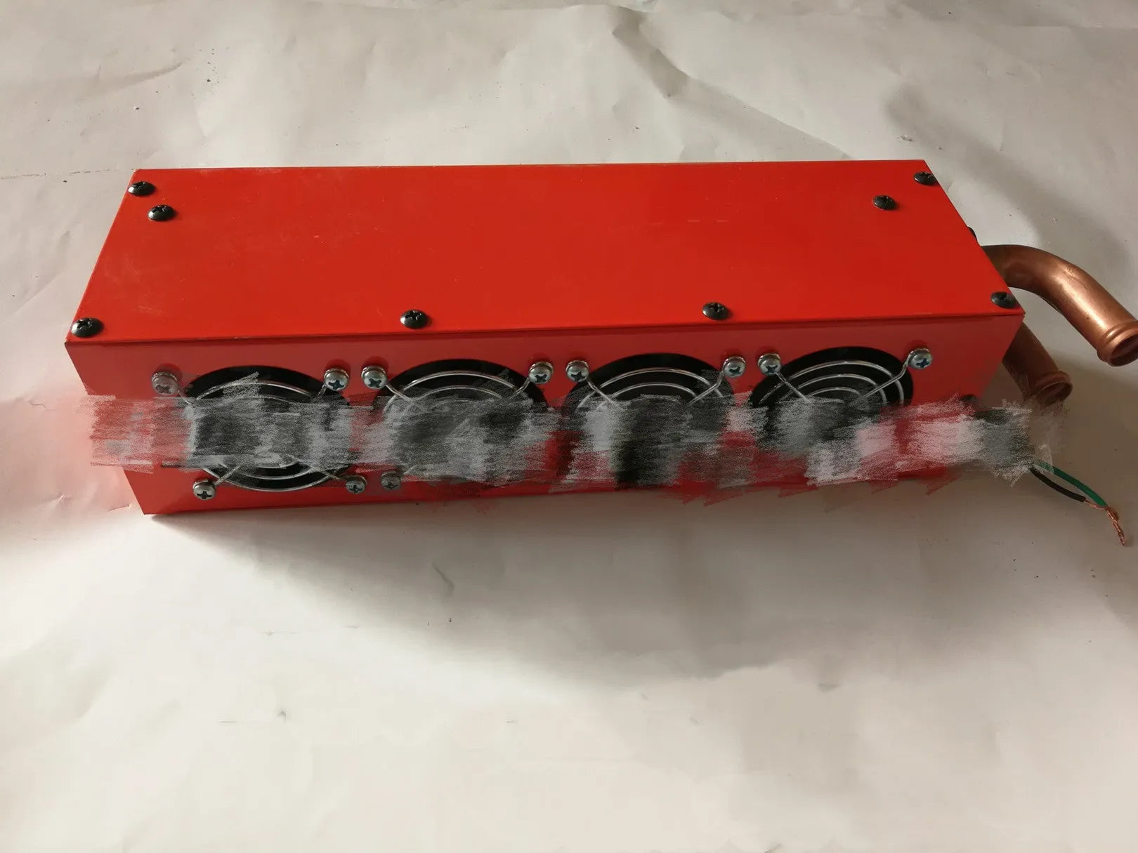 Metal car heater unit with long small four-hole copper pipe connections for 12V 24V vehicles.
