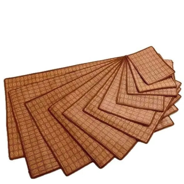 Brown woven rattan fibre cooling mat for dogs on a wooden floor.