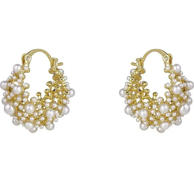 Gold-coloured copper flower basket earrings with small rice-shaped beads and pearl inlay detailing