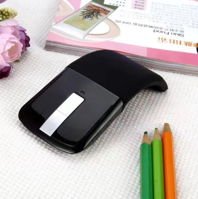 Black folding Bluetooth wireless mouse showing compact 131.2mm design with touch surface