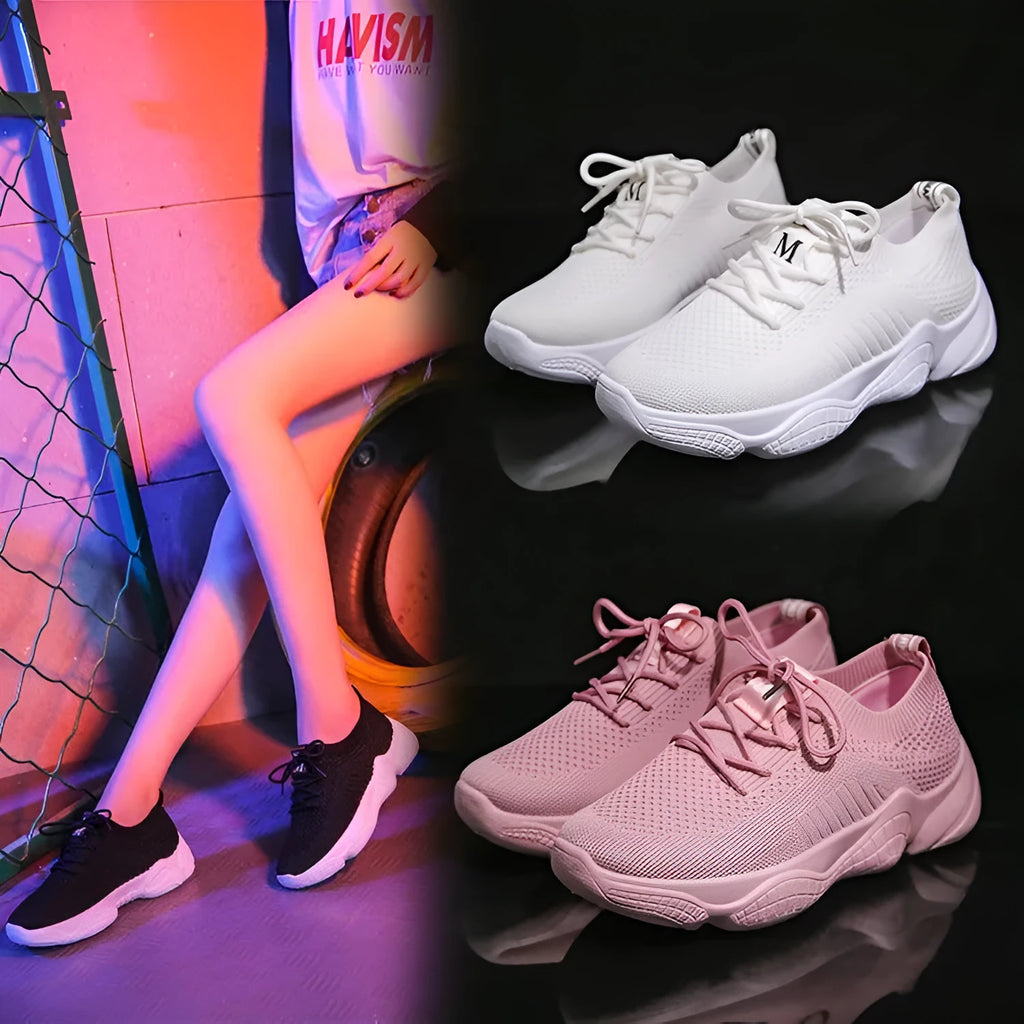 White women's low-top woven sports shoes with thick rubber sole and front strap closure.