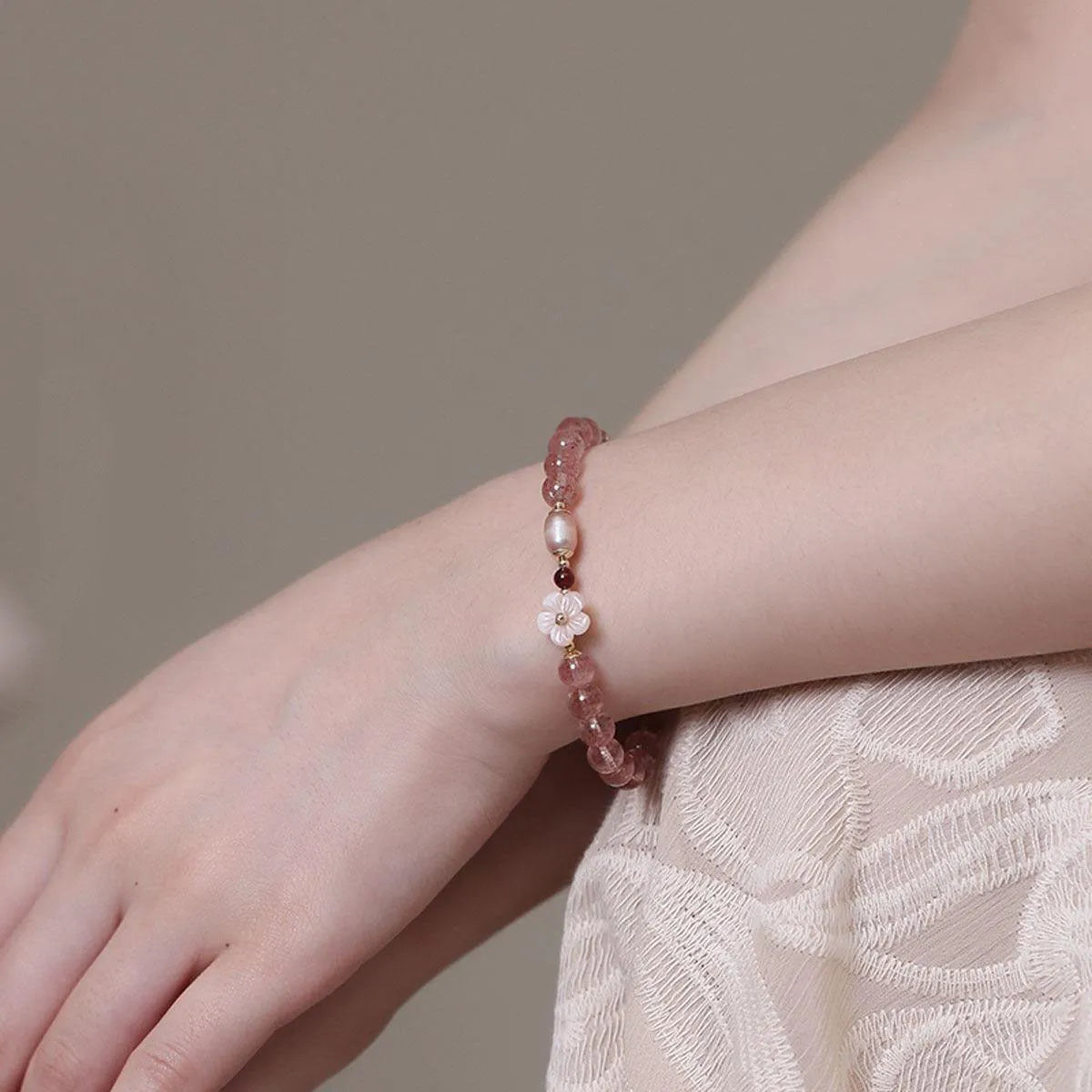 Women's strawberry quartz crystal floral bracelet with adjustable silver-tone chain