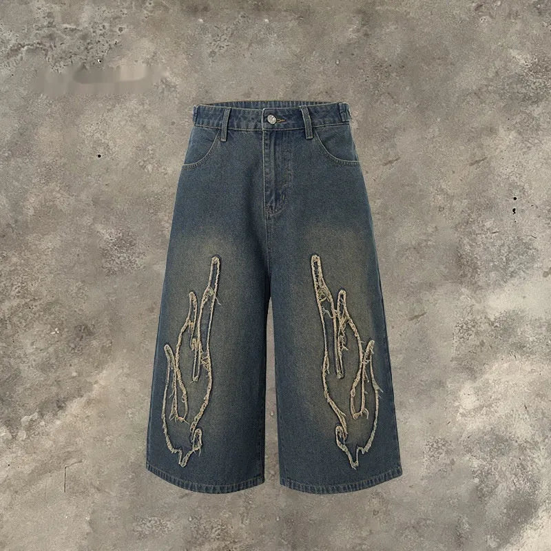 Men's black cropped denim shorts with flame embroidery patches, straight cut street style