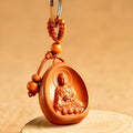 Eight patron saint keychains in peach wood colour, each 10 x 3.2 x 4 cm, Taomu Buddhist keychain set