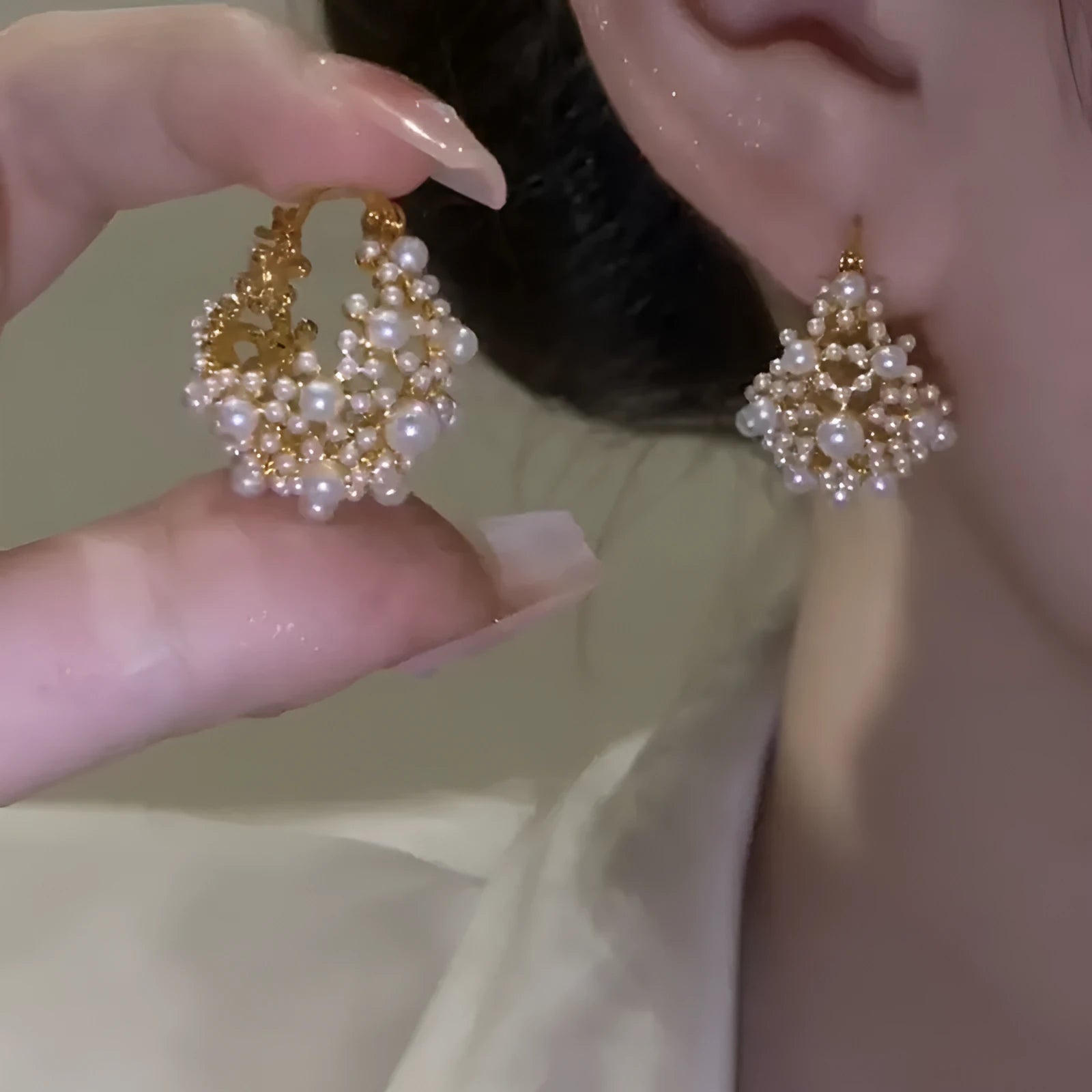 Gold-coloured copper flower basket earrings with small rice-shaped beads and pearl inlay detailing
