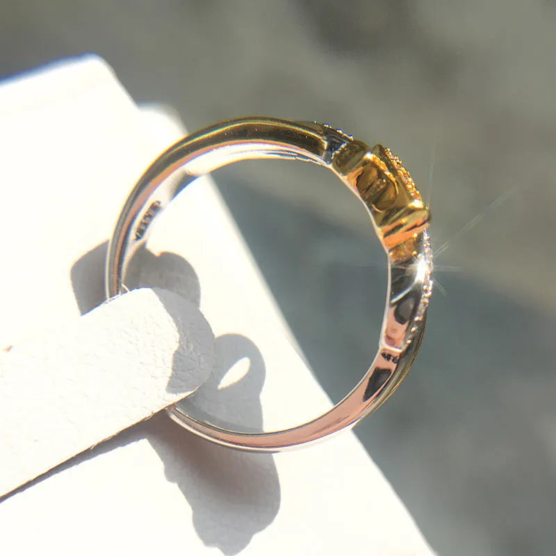 18k yellow gold plated ribbon ring with pink bare stone inlay, geometric unisex design, US sizes 5 to 11.