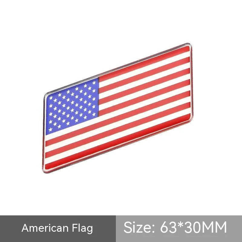 Aluminium national flag car sticker in a parallelogram shape measuring 6.3 by 3 centimetres.