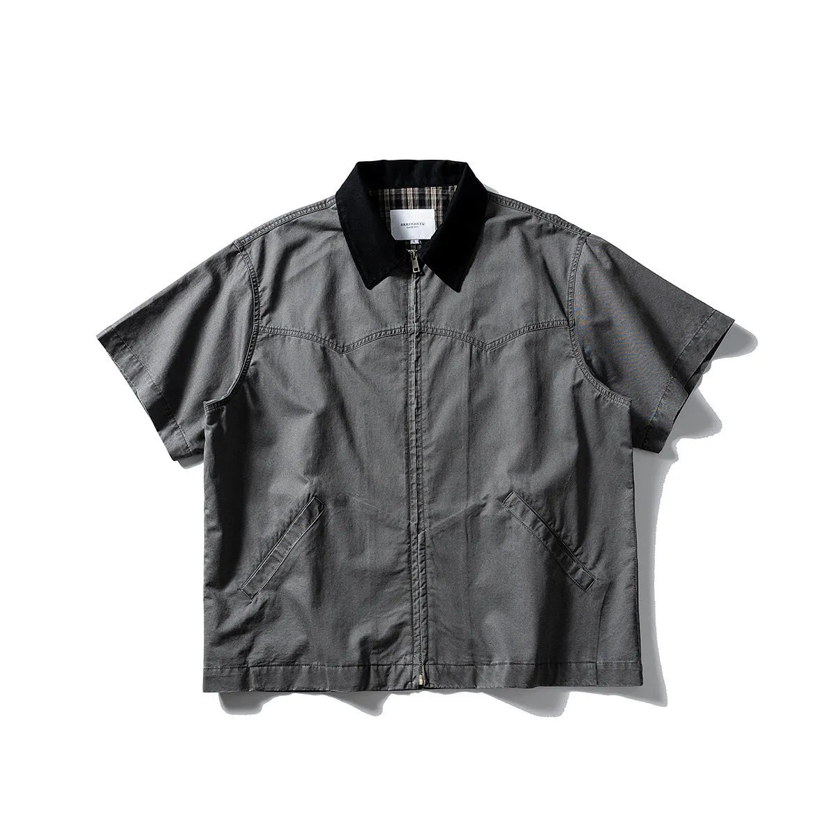 Man's loose-fitting khaki cotton overalls shirt with short sleeves, cardigan style