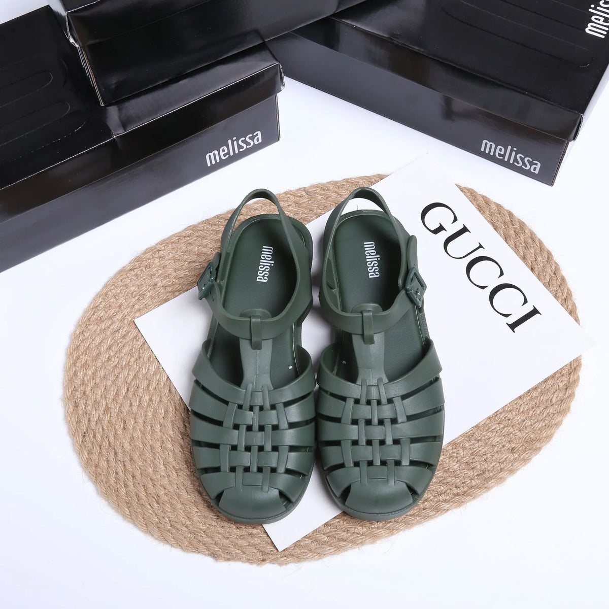 Vintage Weave Roman sandals in matte black with buckle fastening and round toe, showing PVC upper and hollow-out design.
