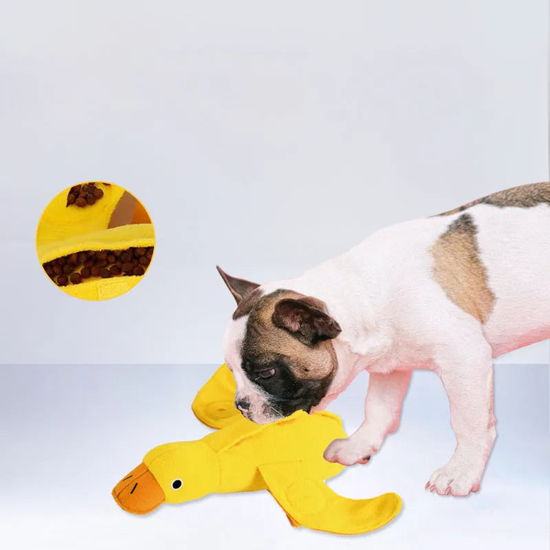 Yellow teddy duck dog toy with food leak openings and squeaker for training and chewing