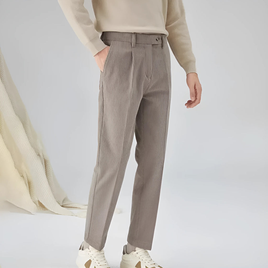 Men's straight-leg corduroy trousers in beige, showing loose fit and textured fabric