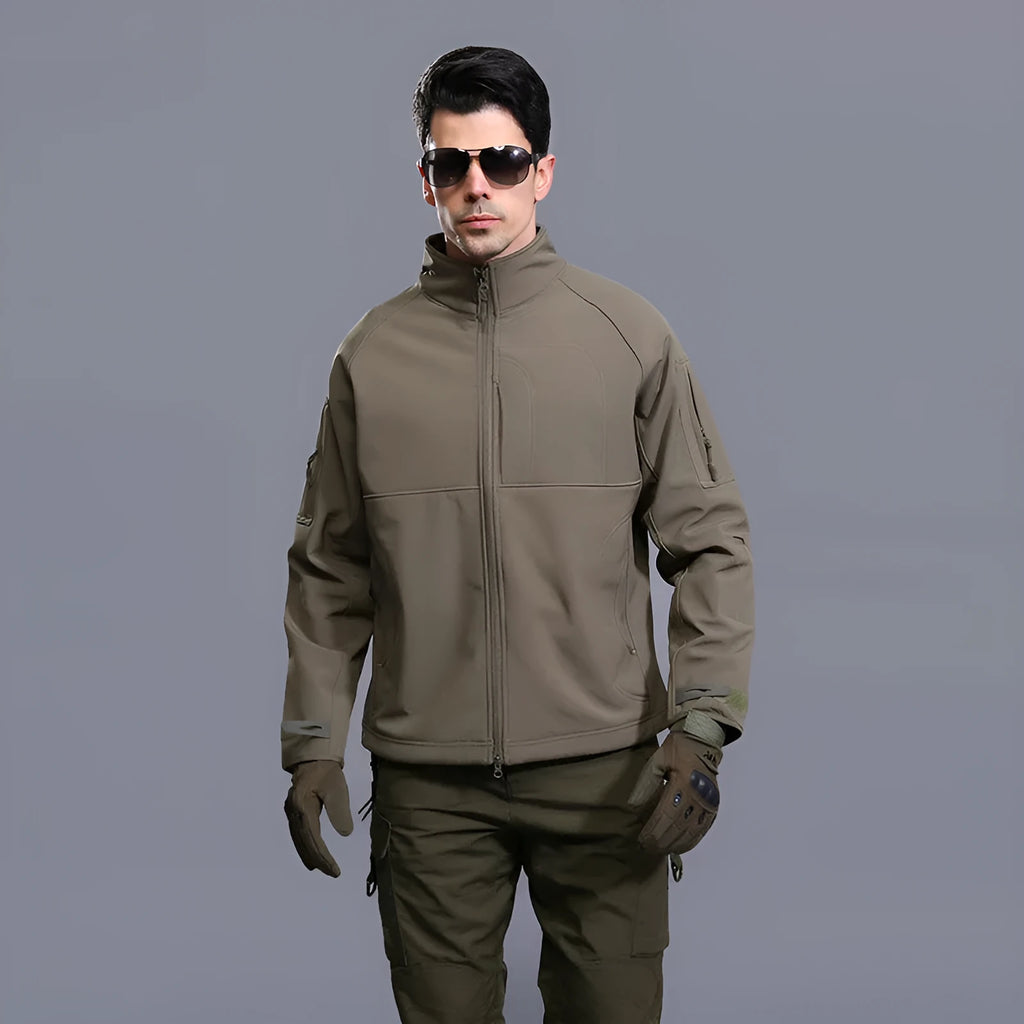 Man wearing a thin green commander stand collar outdoor jacket with a loose fit.