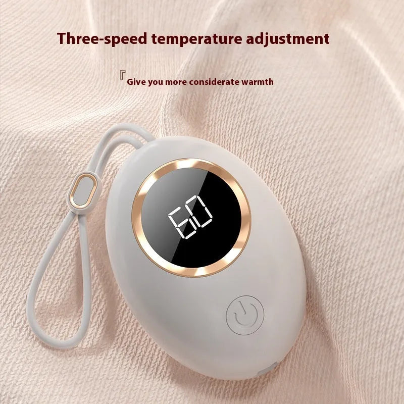 Compact USB rechargeable hand warmer power bank with digital display, shown in pink colour.