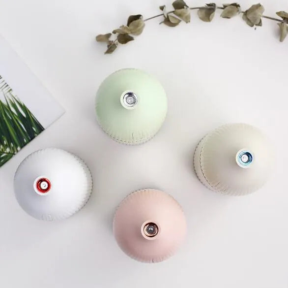 White ultrasonic aromatherapy diffuser and humidifier with LED light and 300ml capacity.