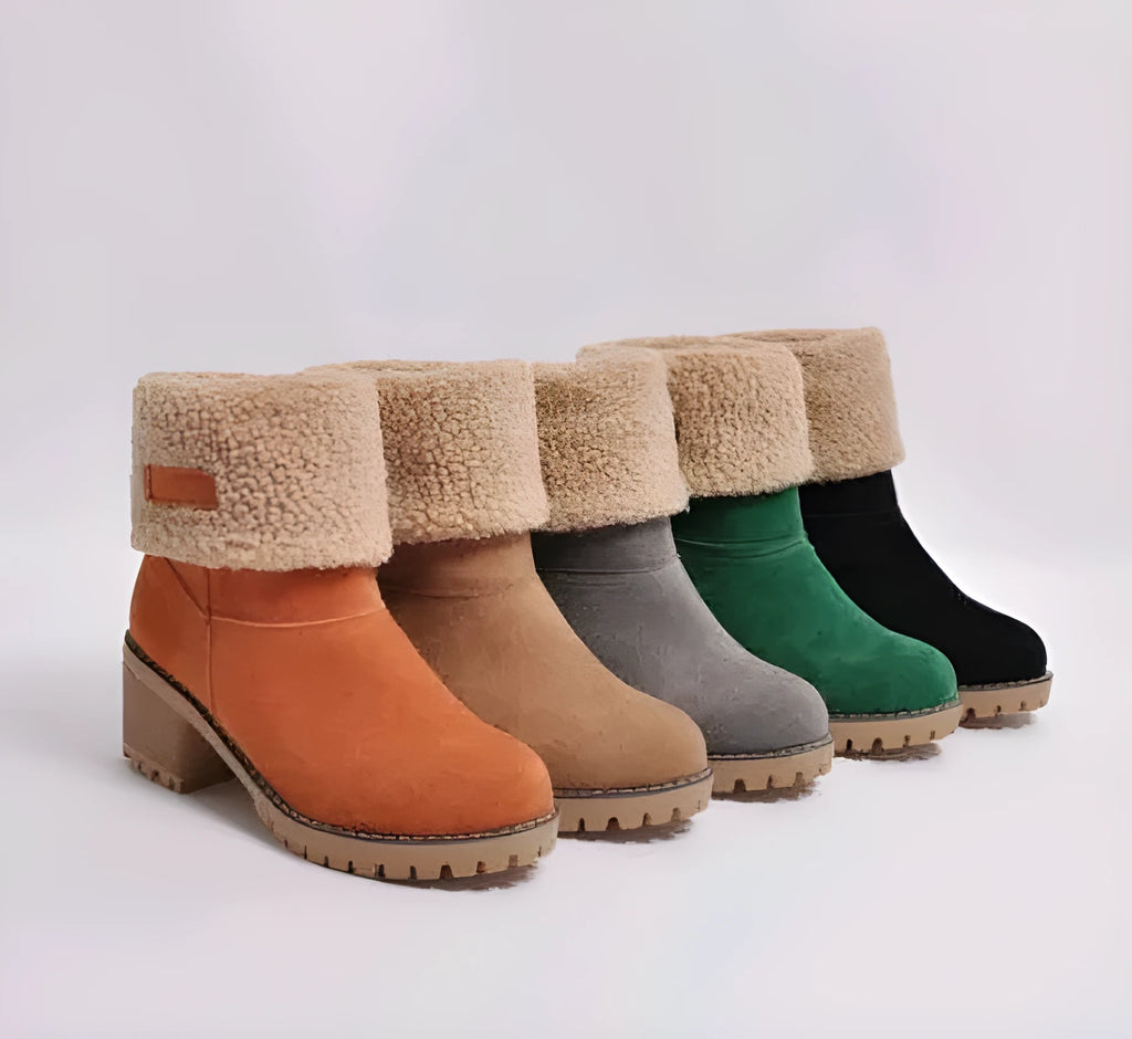 Women's mid-calf suede snow boots with a low heel and round toe in multiple colour options.