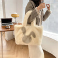 Cartoon rabbit ears design on a solid colour plush tote bag for women.