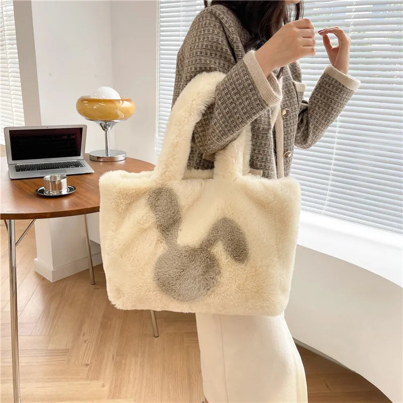 Cartoon rabbit ears design on a solid colour plush tote bag for women.