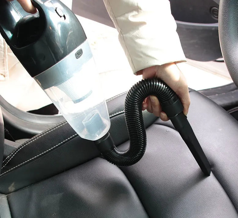 Orange 12V handheld car vacuum cleaner with nozzle and long power cord