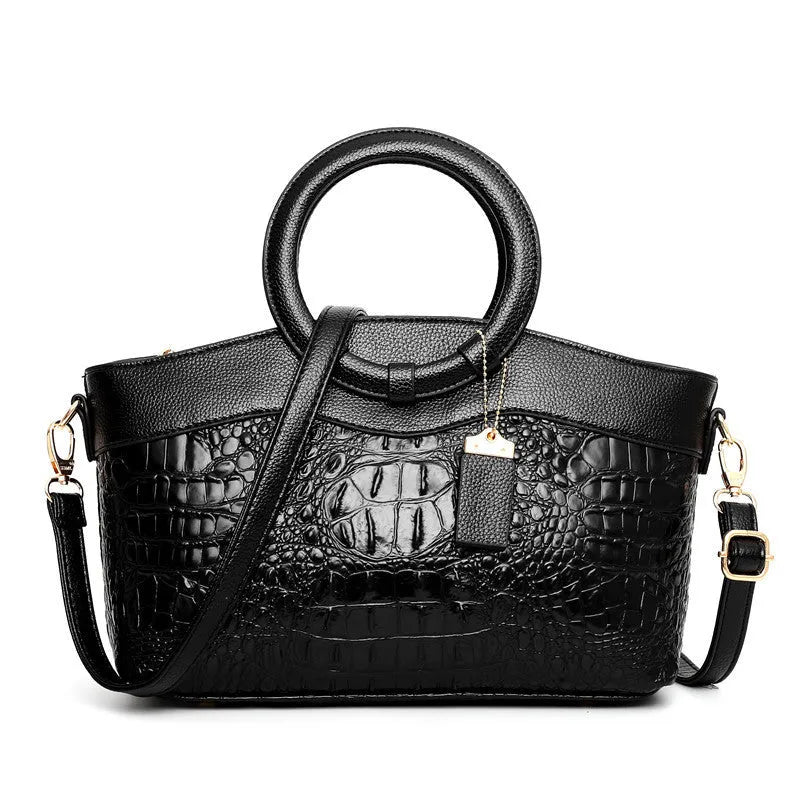 Ladies fashion handbag in multiple colours with zipper compartments measuring 31cm by 21cm by 13cm