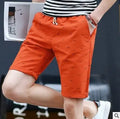 Men's thin cotton summer shorts in khaki with a mid-waist and drawstring closure laid flat.