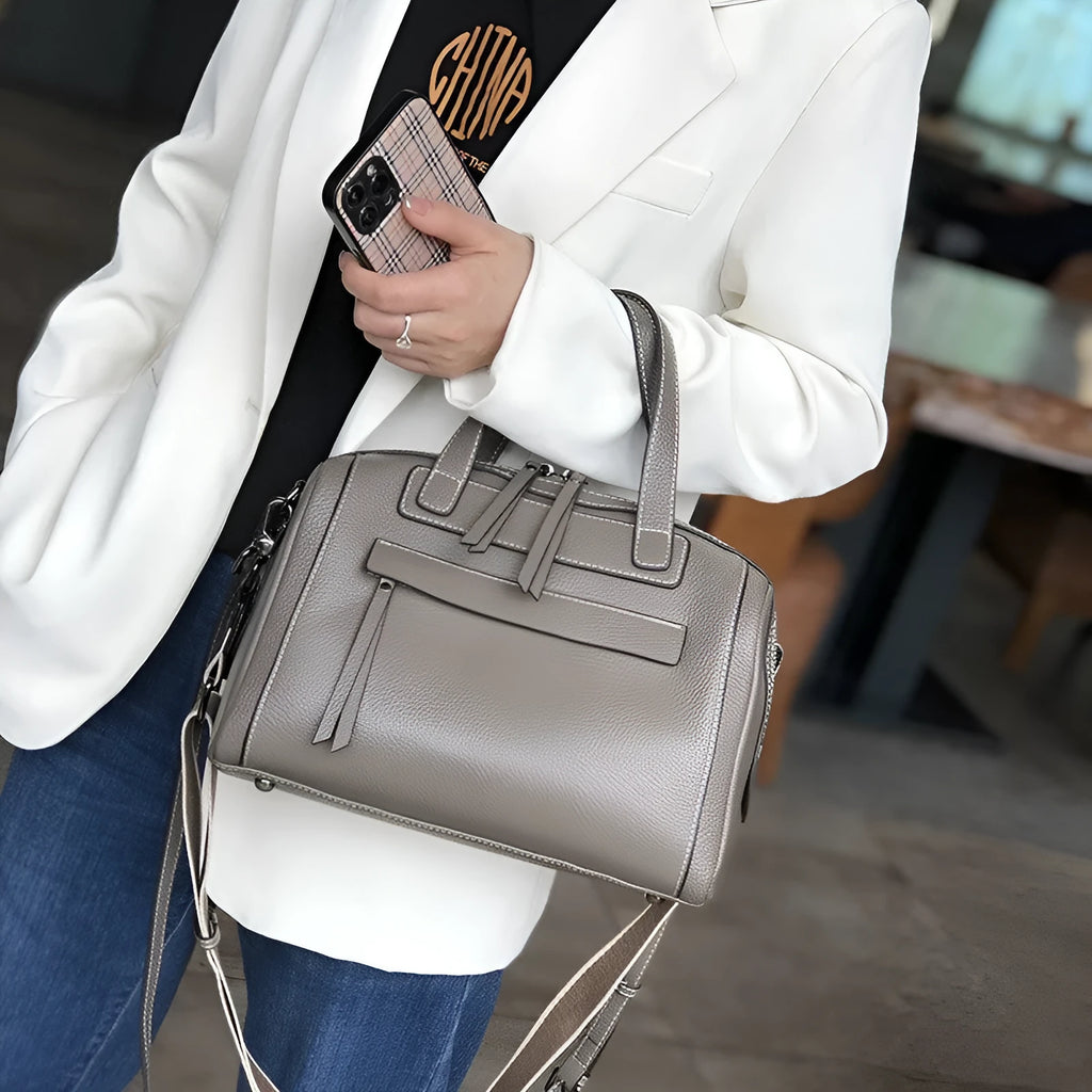 Men's horizontal square leather messenger bag with litchi pattern, shown in elephant grey with shoulder strap.