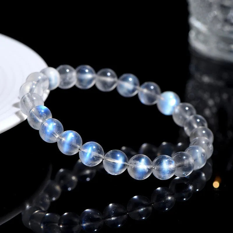 Natural cream body blue moonlight crystal bracelet showing simple design and crystal details.