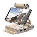 Gamesir-X1 Eat Chicken Throne Bluetooth mobile gaming controller adapter in gold or silver on a desk.