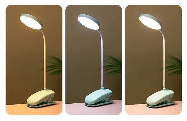LED clip-on desk lamp with touch dimming, plastic shade, available in white, pink, or green.