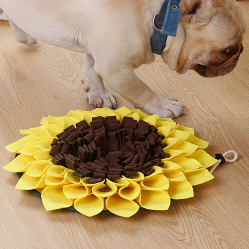 Yellow sunflower-shaped dog snuffle mat with rope attachment for nosework training