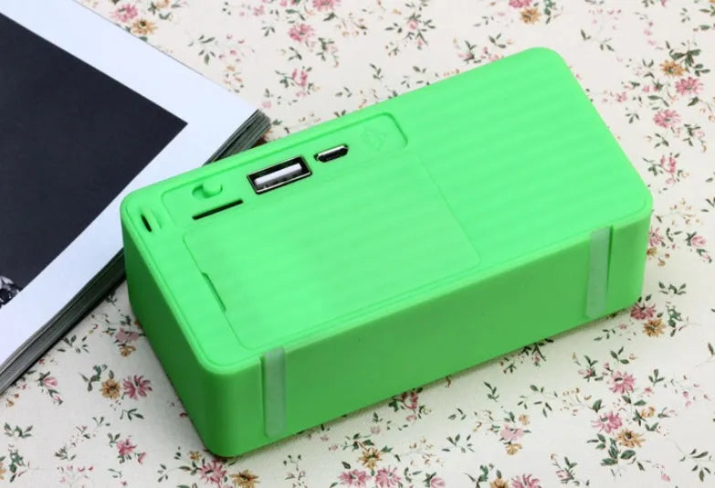 Cannon X3 portable wireless Bluetooth speaker with FM radio in multiple colours on outdoor ground