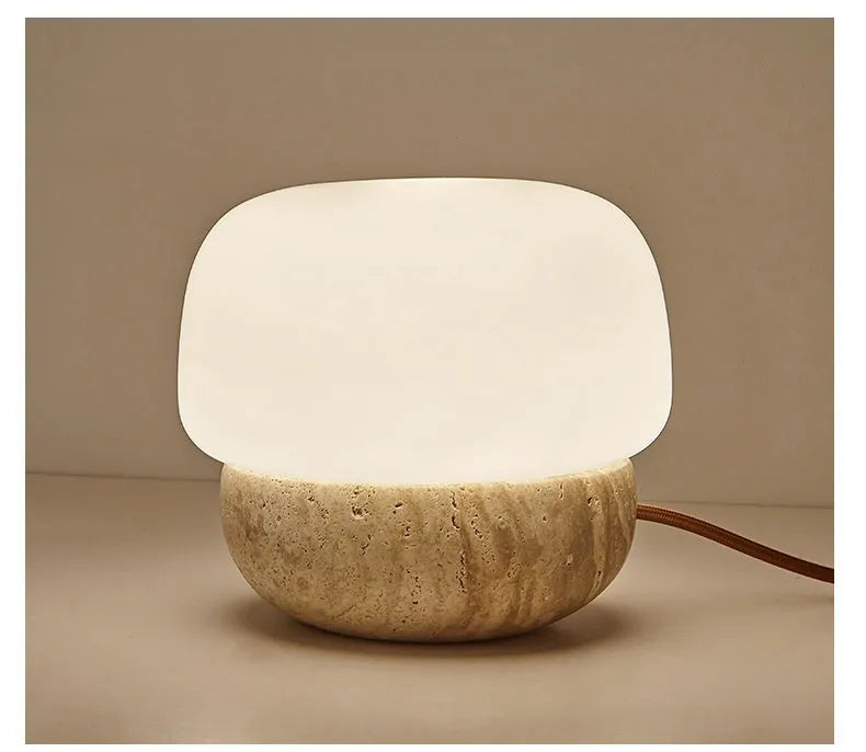 Cream coloured retro bedside lamp with button switch on small table