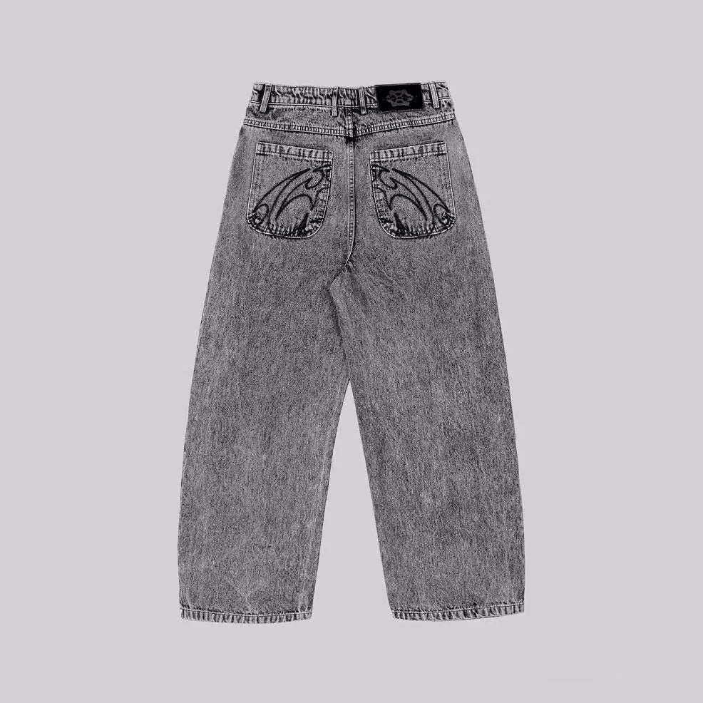 Grey loose straight-leg denim trousers on hanger showing mid-rise waist and cotton denim fabric
