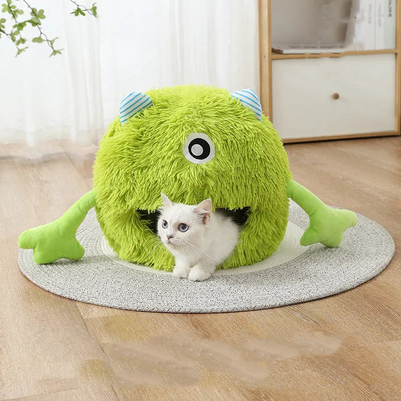 Fluffy round plush cat bed with a non-slip bottom, shown in grey.