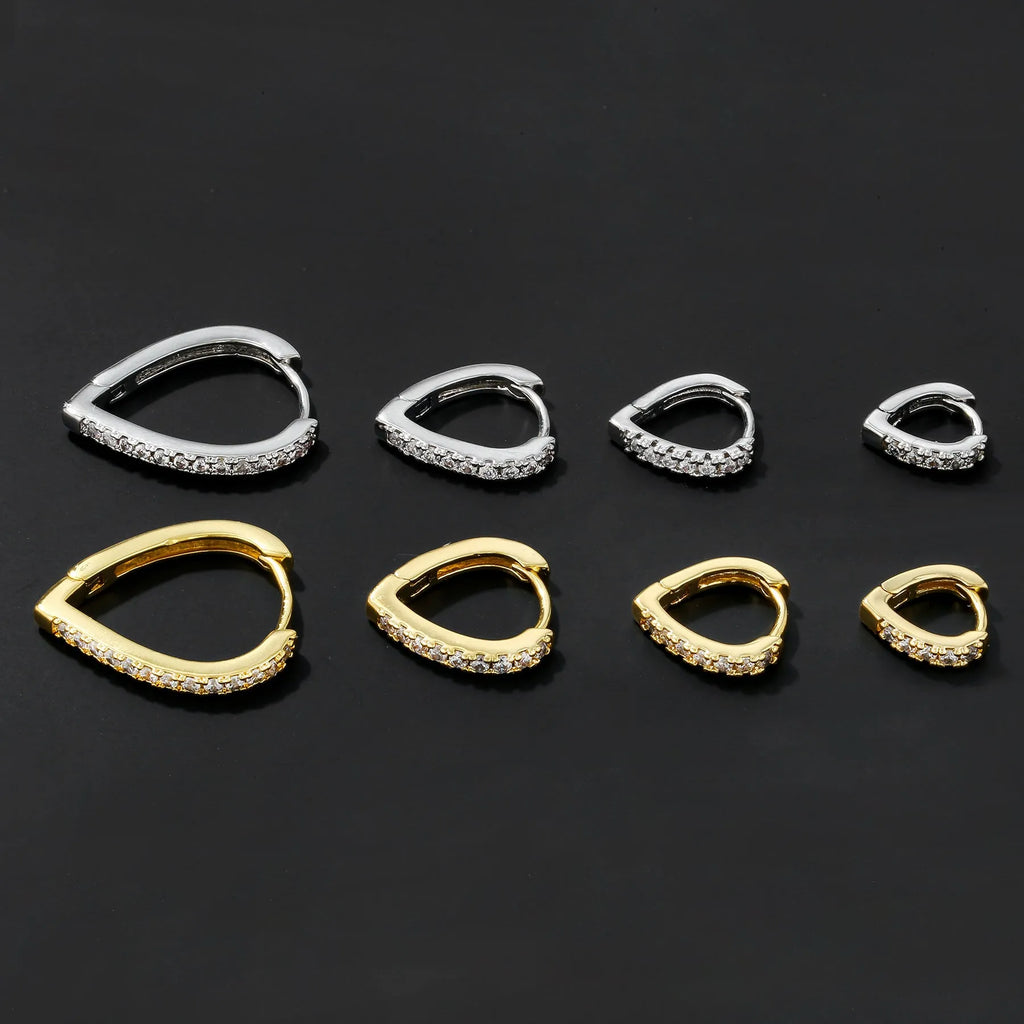 Geometric heart-shaped ear clips in gold and white colours on copper with clip back