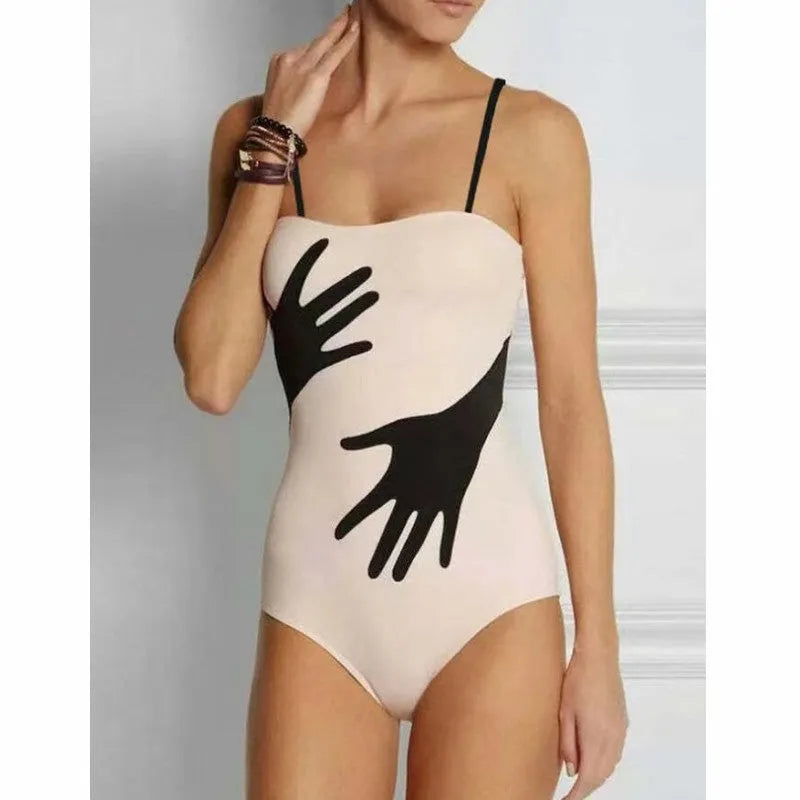 Women's one-piece bikini swimsuit with an attached white tulle skirt, shown on a mannequin.