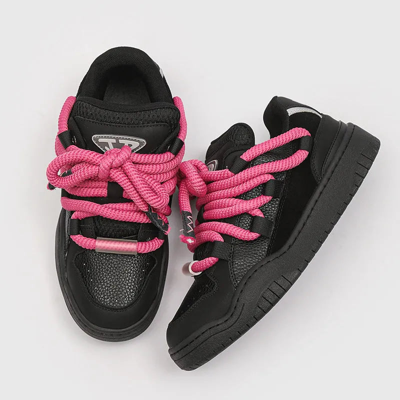 A pair of low-top casual sneakers with a thick rubber sole and front lace-up closure, shown in a choice of four colours.