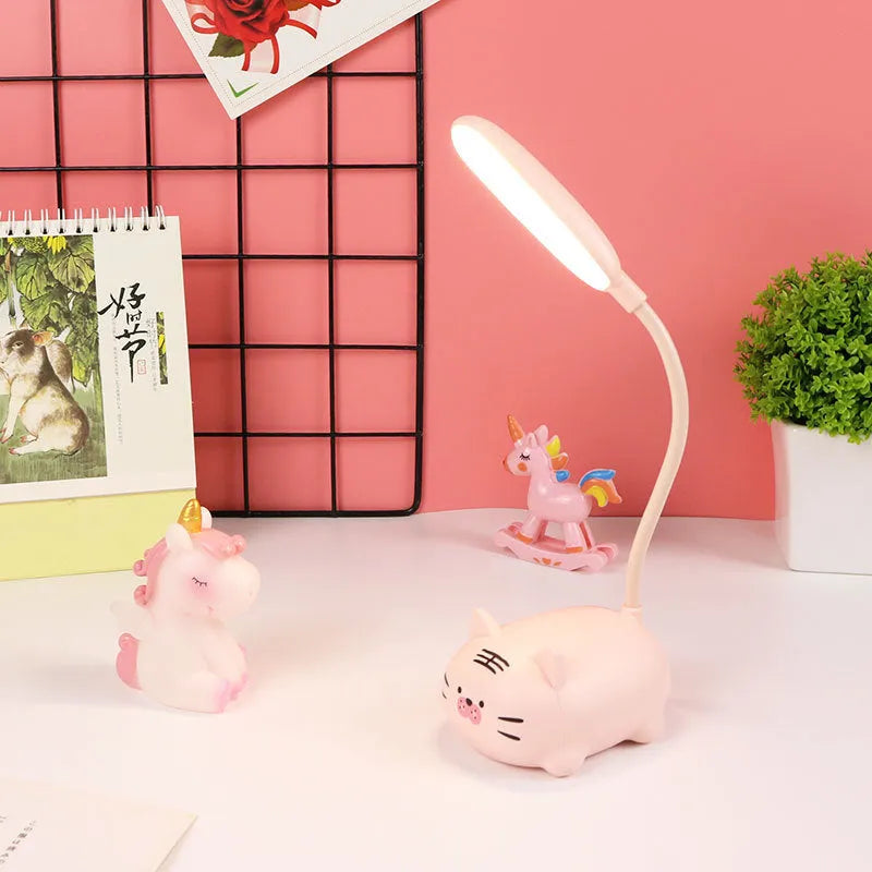 USB rechargeable LED book light in warm white, available in blue or pink with animal designs