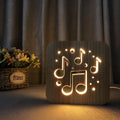Square pine wood USB LED atmosphere lamp with warm white light on a surface.